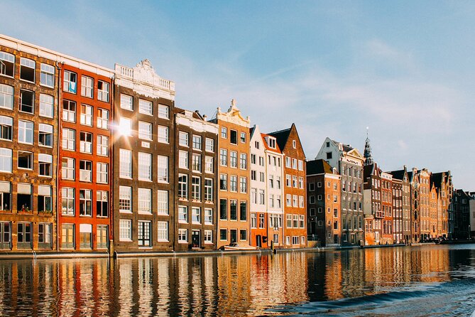 Amsterdam Day Trip from Brussels With Cheese, Clogs and Windmills - Amsterdam Arrival: Dam Square, the Royal Palace Area, and a Walking Orientation