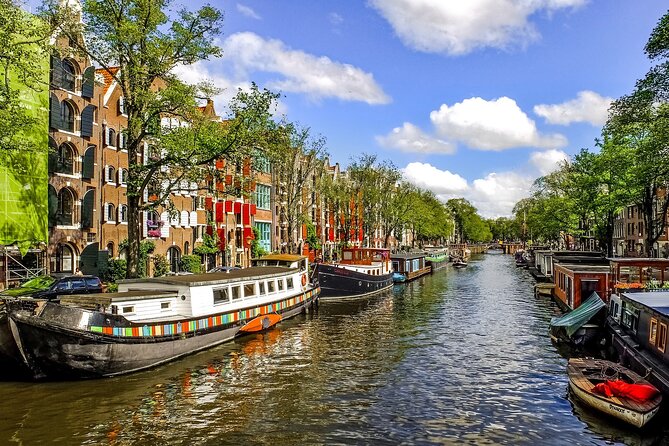 Amsterdam Day Trip from Brussels With Cheese, Clogs and Windmills - Heineken Brewery, Dutch Banks, and the Bus-Route Reality