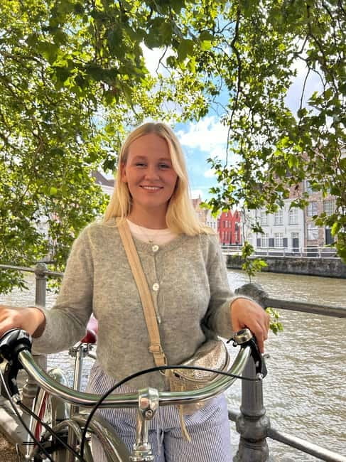 Bruges: City Bike Tour with a Local - Finding the Blue Door start, then easing into Bruges by bike