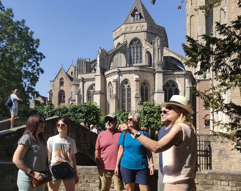 Bruges: Small Group Boat Cruise and Guided Walking Tour - Four Horsemen and the courthouse facade drama