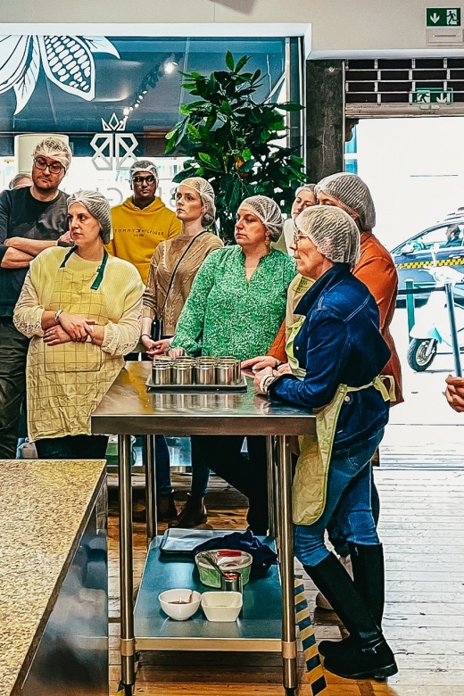 Brussels: Belgian Chocolate Making Workshop with Tastings - Inside the training centre: hairnets, cold air, and hands-on stations
