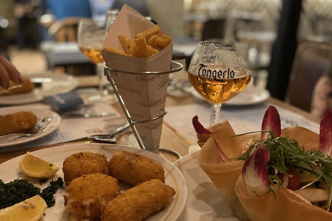 Brussels Food Tour: 10 Tastings of Waffles, Beers, Fries & More - Starting at Auguste Orts Statue, and why the meeting point matters