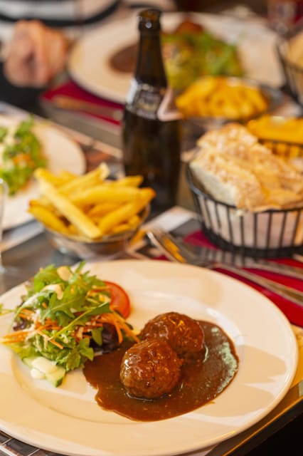Brussels Food Tour: Main Dish, Beer, Waffle & Chocolate - Entering Brussels Through Food: Place Poelaert as Your Starting Line
