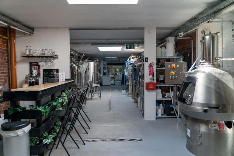 Brussels: micro brewery & distillery tour + beer tasting - Entering Tipsy Tribe in Brussels, a brewery-distillery combo