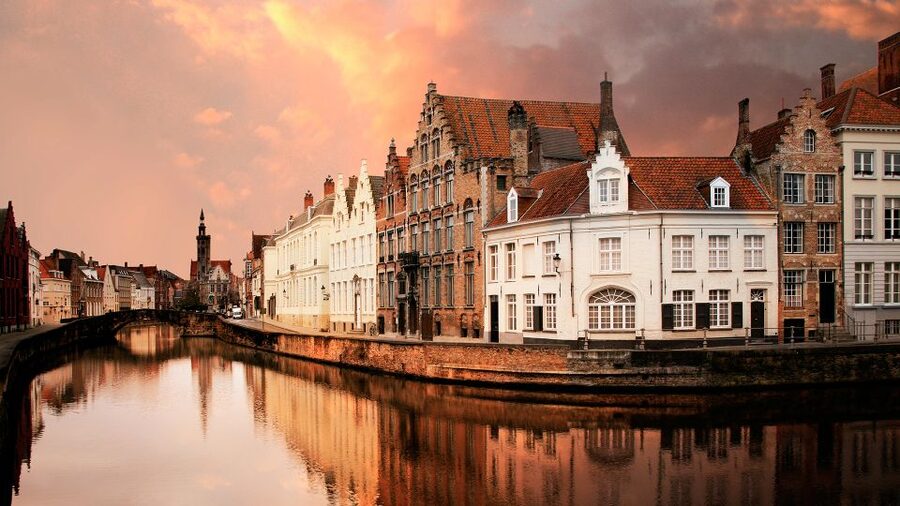 From Amsterdam: Bruges Day Trip in English with Boat Option - Coach comfort, radios, and real-world logistics you should note