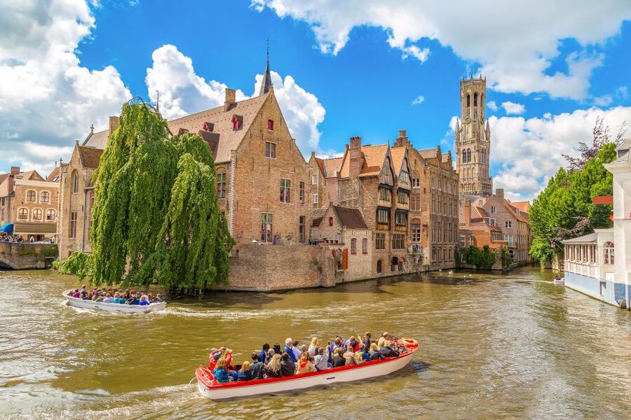 From Paris: Day Trip to Bruges with Optional Seasonal Cruise - The medieval center: City Hall, Place du Bourg, and canals that start in the 12th century