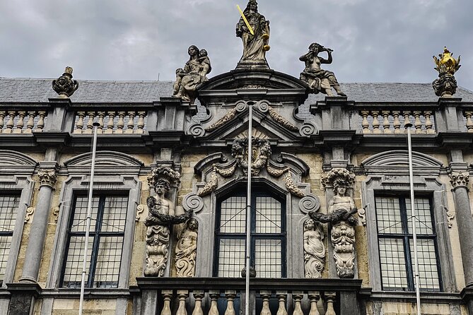 Secrets of Bruges: Walking Tour With a Chocolate and Waffle Bite - Canal-side drama: the square debate, romantic canals, and two bridges