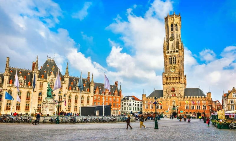 Top Highlights of Bruges from Zeebrugge Port - Vismarkt and De Burg: Fish Market Energy and City Hall Grandeur